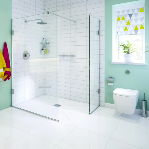 A stylish and practical walk-in shower with a built-in shelf for toiletries.